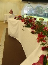 Wire, calla, gerbera and lily top table decoration